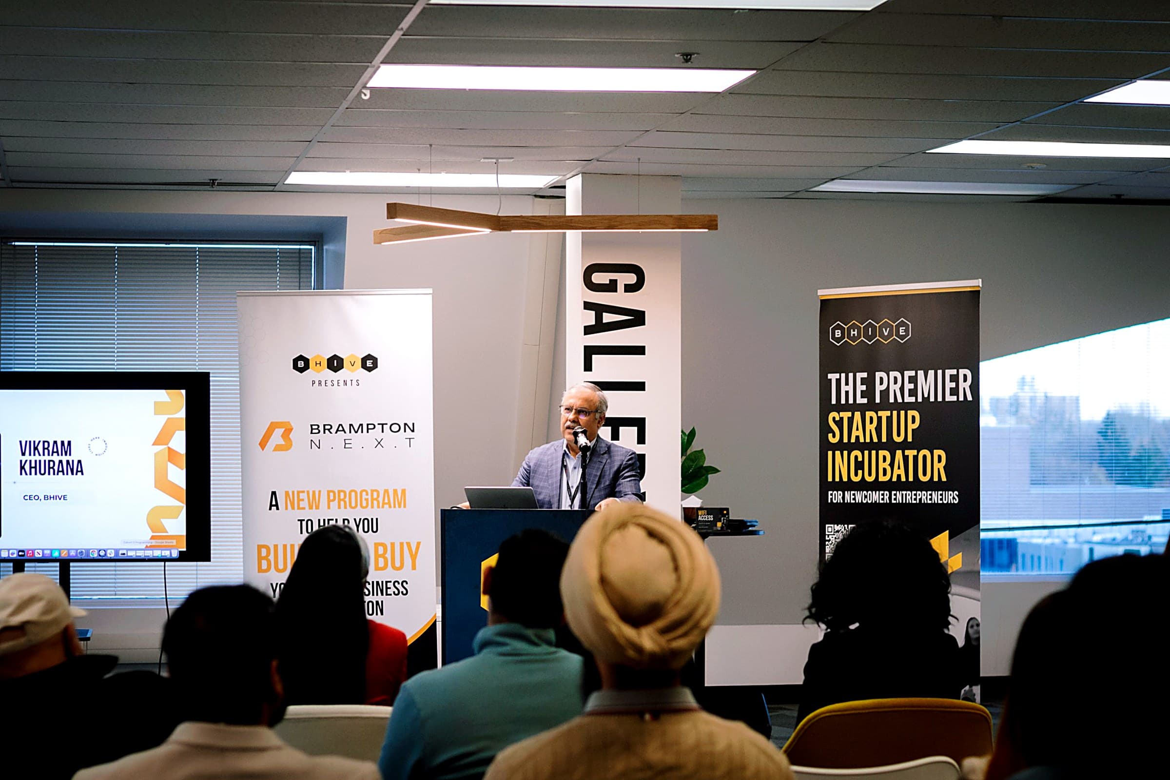 A speaker presenting to established business owners