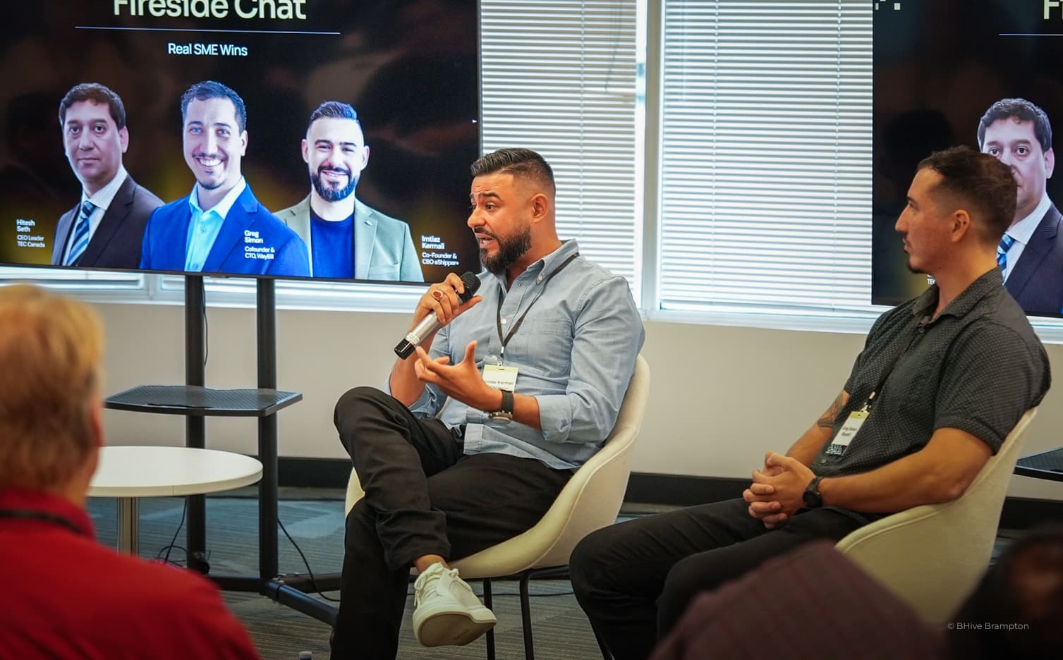 A speaker addressing a BNext AI panel discussion