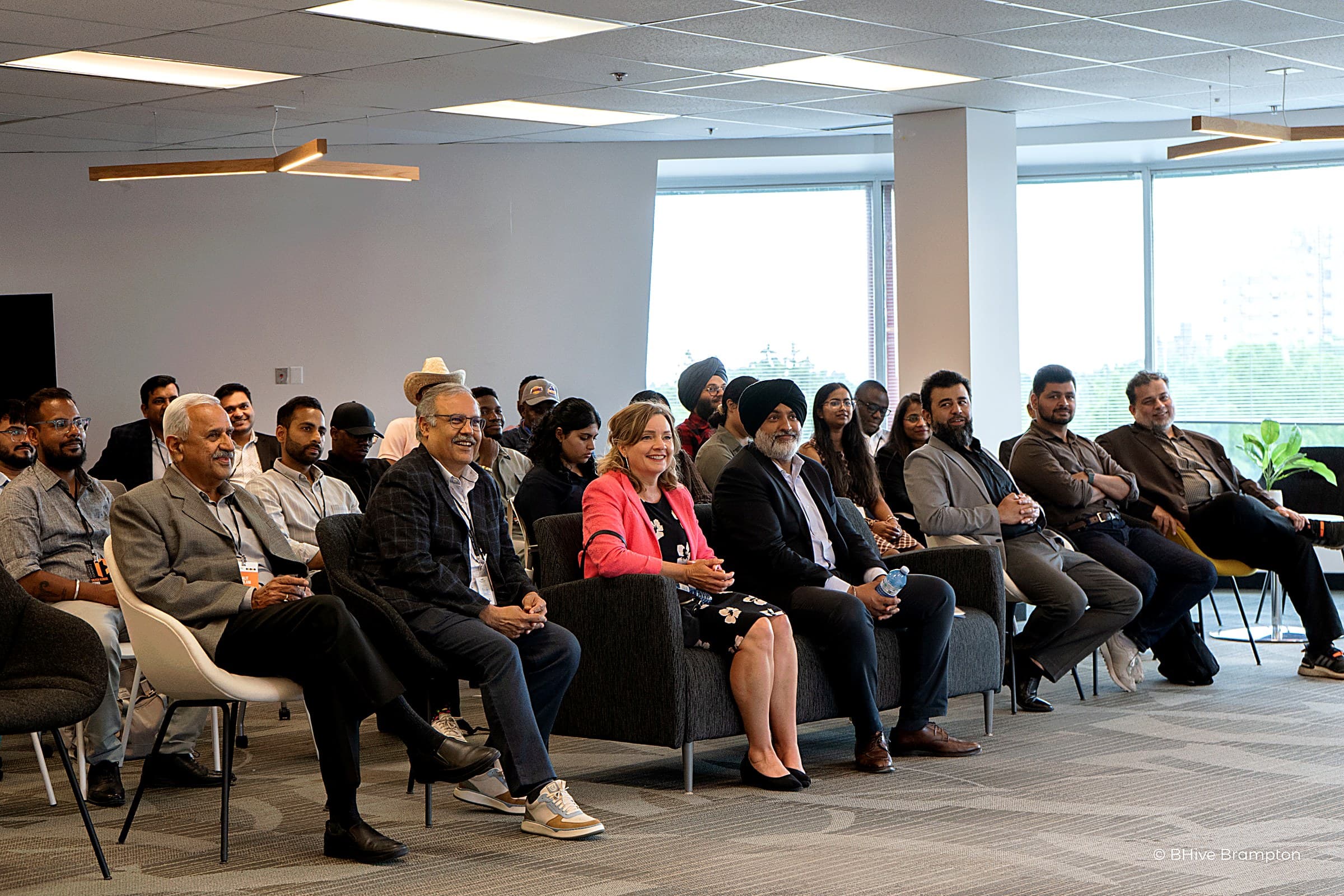 Business owners seated at a BNext AI session