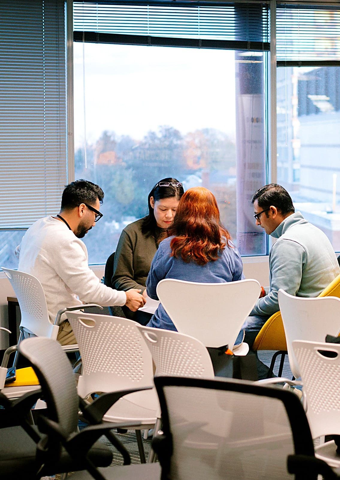 Business owners discussing around a meeting table