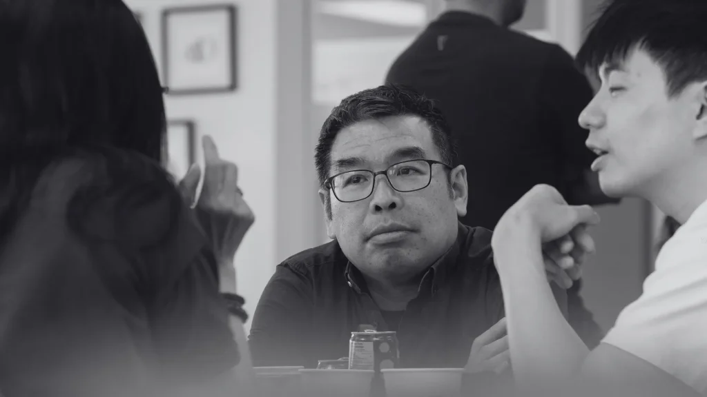 Founders sitting at a roundtable discussing business ideas